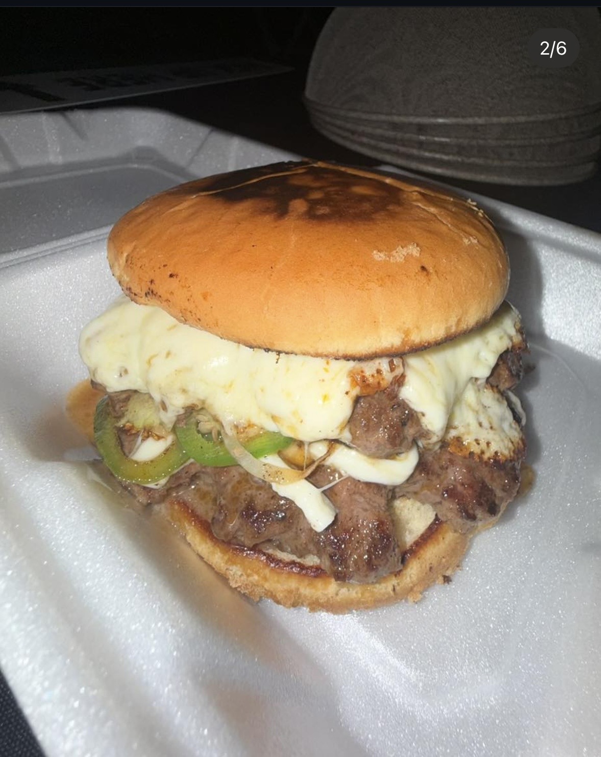 Texas smash burger with melted cheese and jalapeños